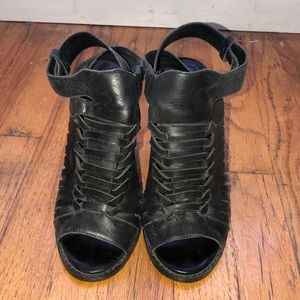 “Intentionally _____” black heel